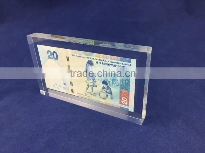transparent plastic acrylic logo block with money