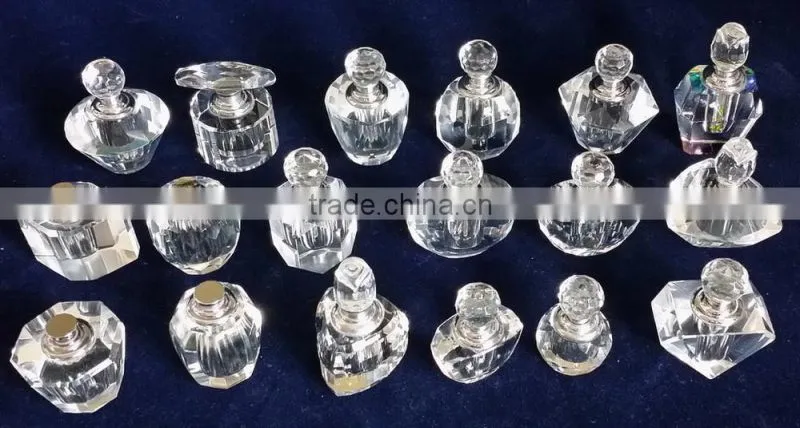 small empty clear crystal perfume bottle with jewelled metal alloy handle
