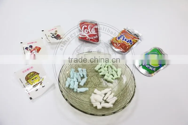 Cola bottle shaped compressed fizzy hard candy with tatoo paper