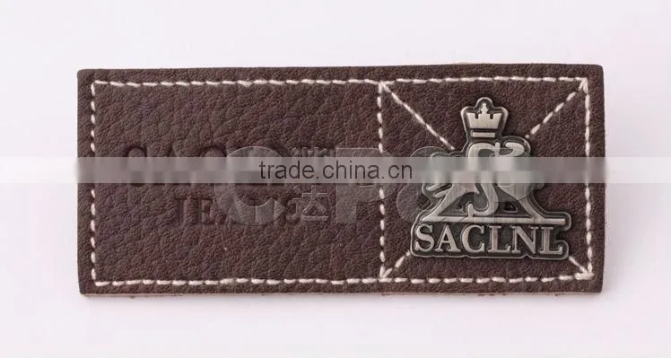 Sewing lace down metal logo embossed leather label