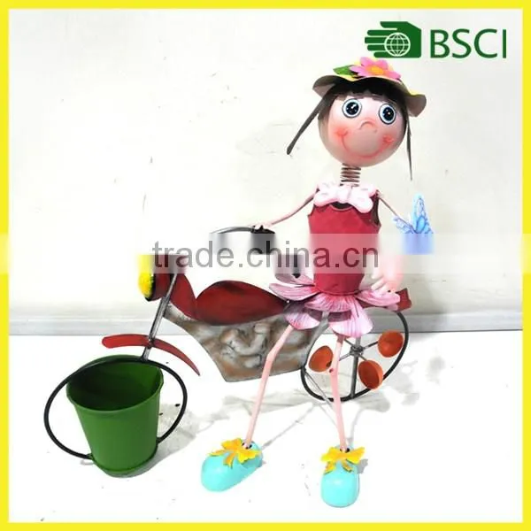 Nice girl garden planter with bicycle for decoration