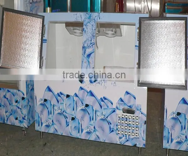 Upright ice merchandiser with fan cooling system