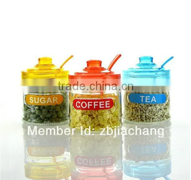 glass spice box with plastic cap and spoon