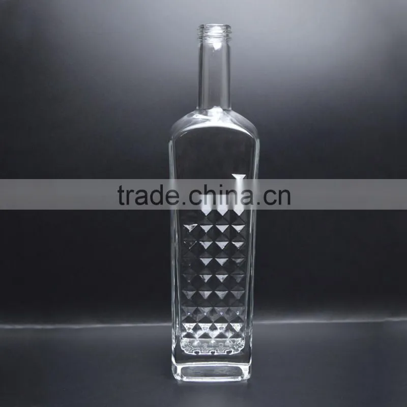 Whiskey bottle in glass with aluminum cap