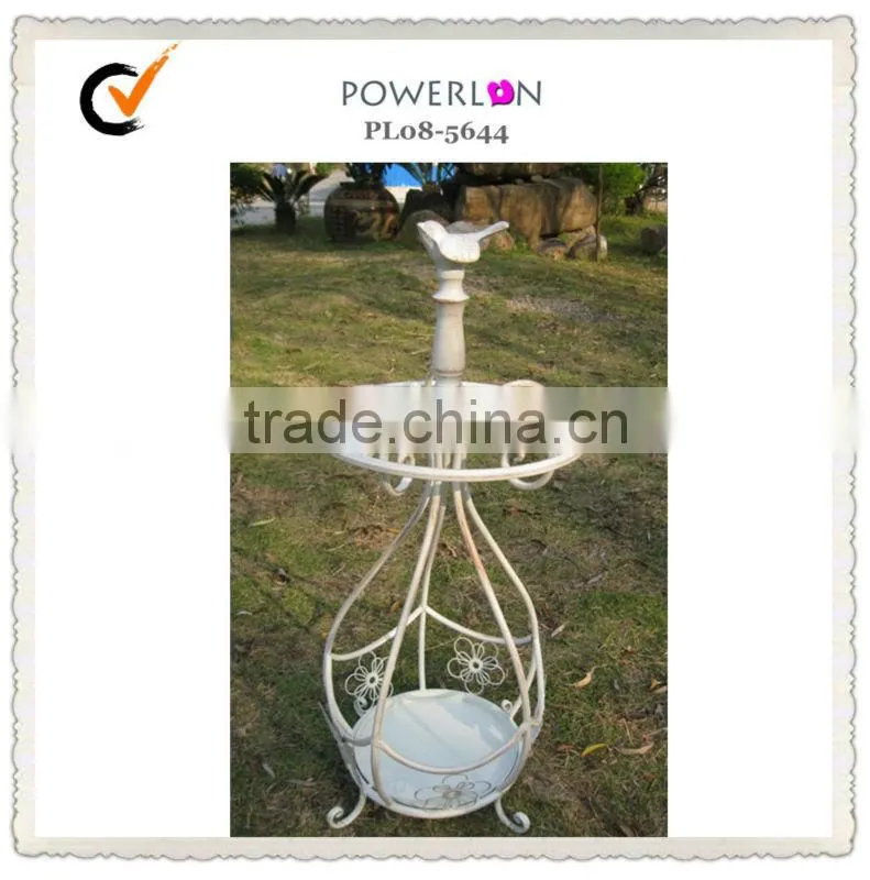 Antique metal basket beach umbrella holder