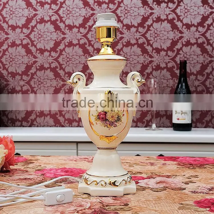 Gold outline home goods ceramic vase table lamp in bedroom