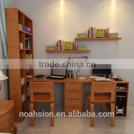 couple desktop laptop work desk with bookshelf