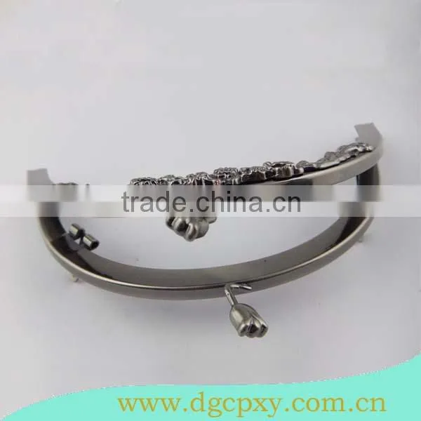 gunmetal round shape frame with flower carved pattern and flower kiss lock