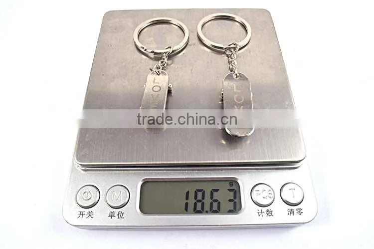 promotional items custom logo metal skateboard keychains