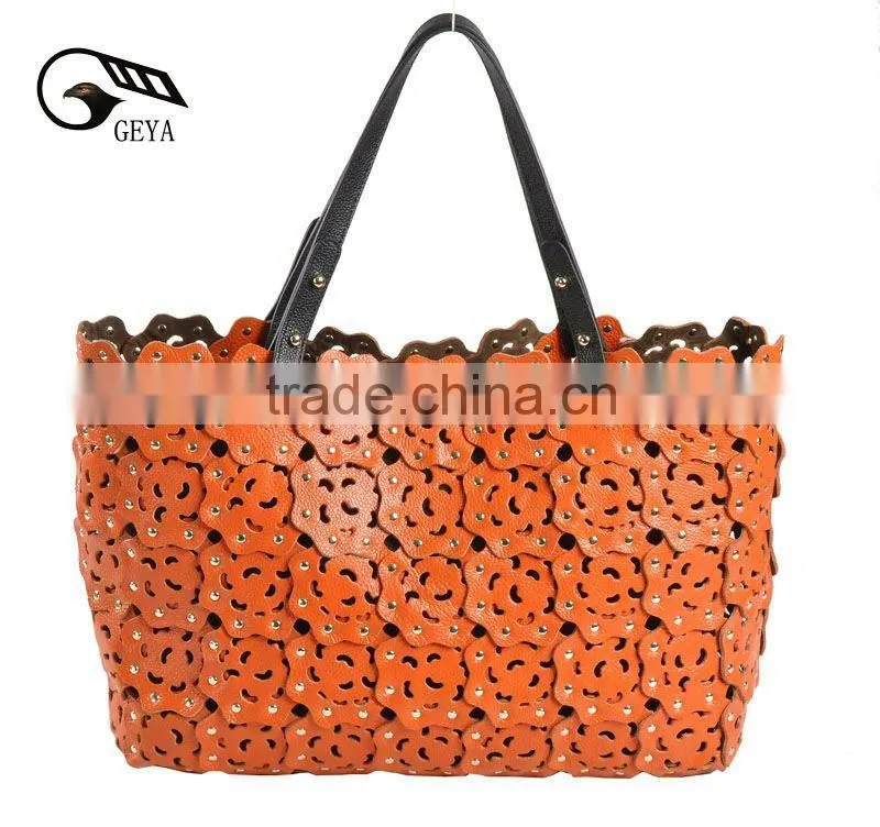 2012 fashion leather handbag ladies bag with punch flower patterns!