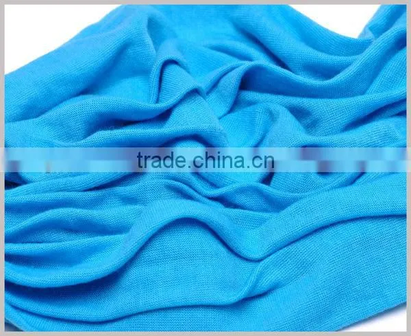 Women adorn article scarf with jewelry