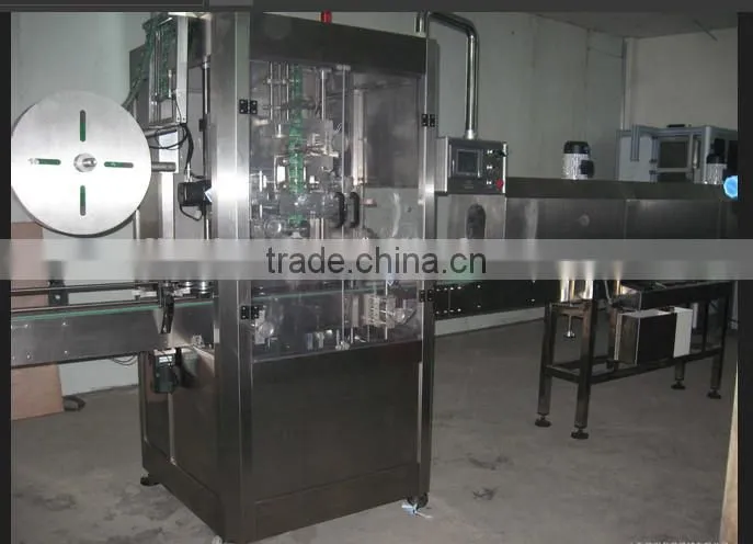 sleeve labeling machine with label shrinking tunnel and steam generator
