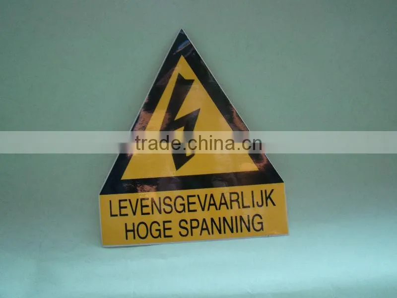 hanging construction sign with holes