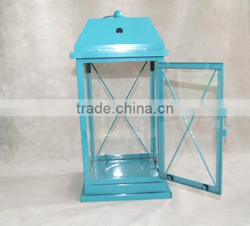green metal lantern with clear glass wall