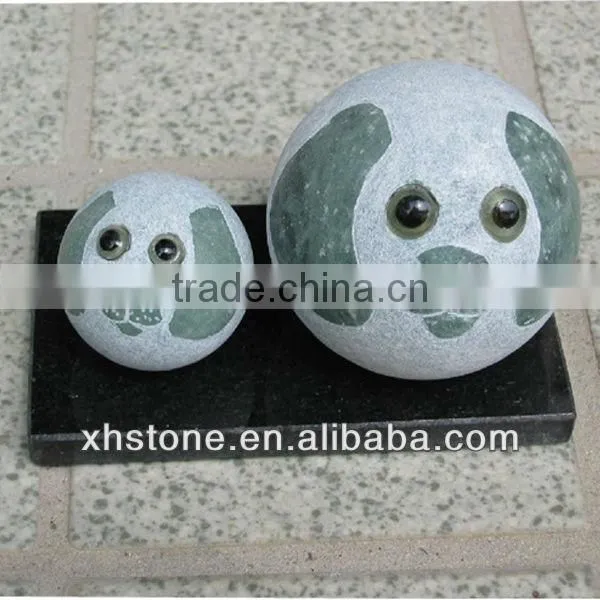 Green round dog stone statue