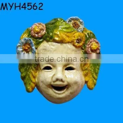 A sweet, handmade and hand painted Italian ceramic mask adorned with grapes