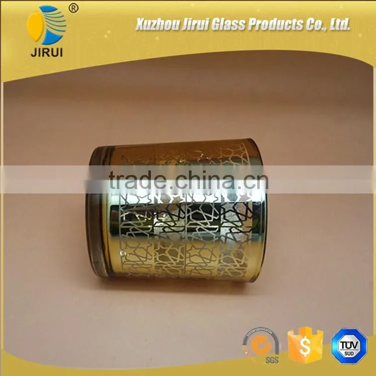 gold glass candle holder with unique pattern