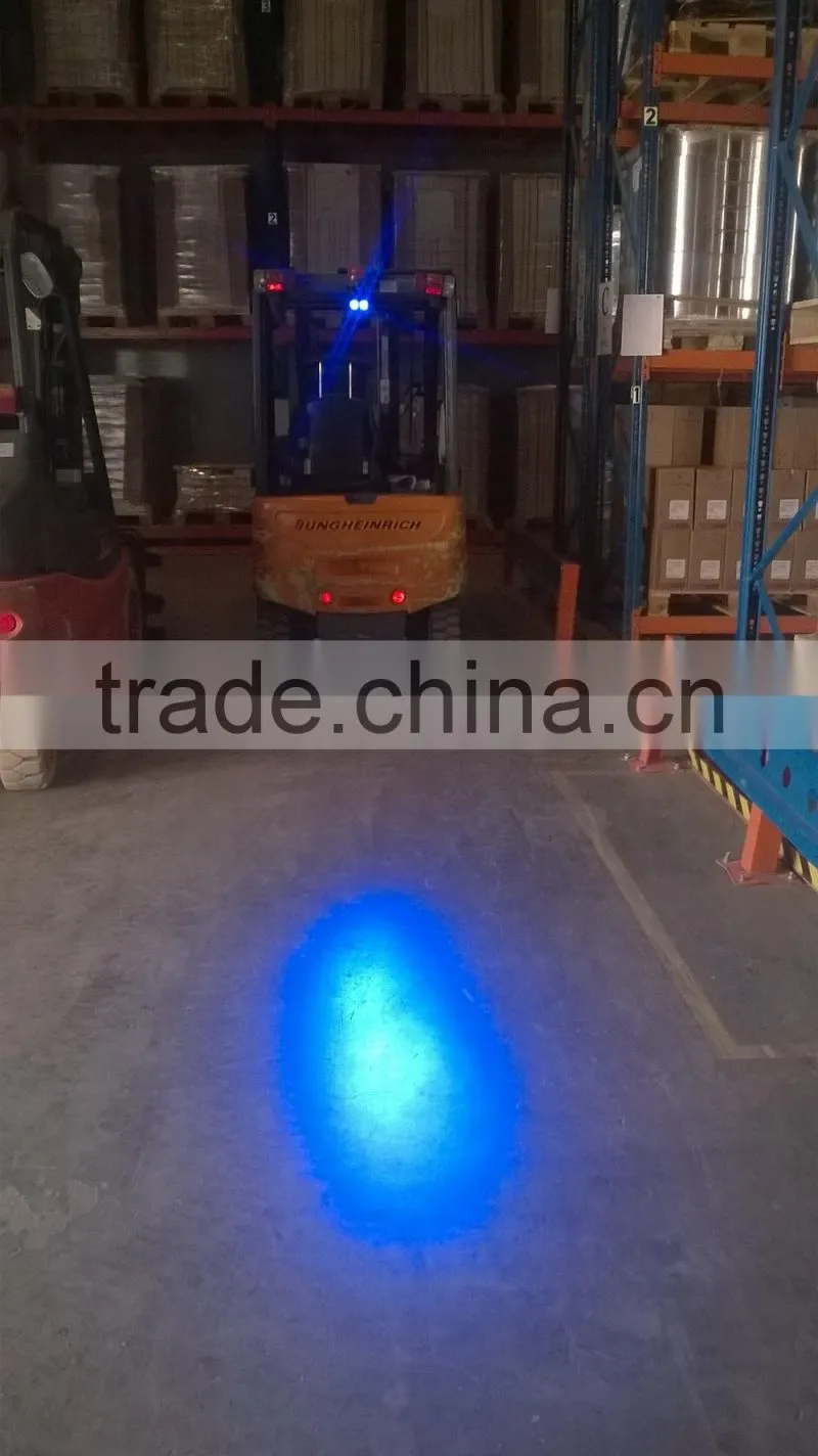 Forklift approaching blue warning light