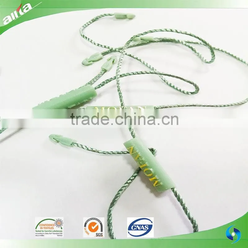 China Gold Supplier, customize gold color seal tag with letters embossed on light freshening green garment plastic hang tag
