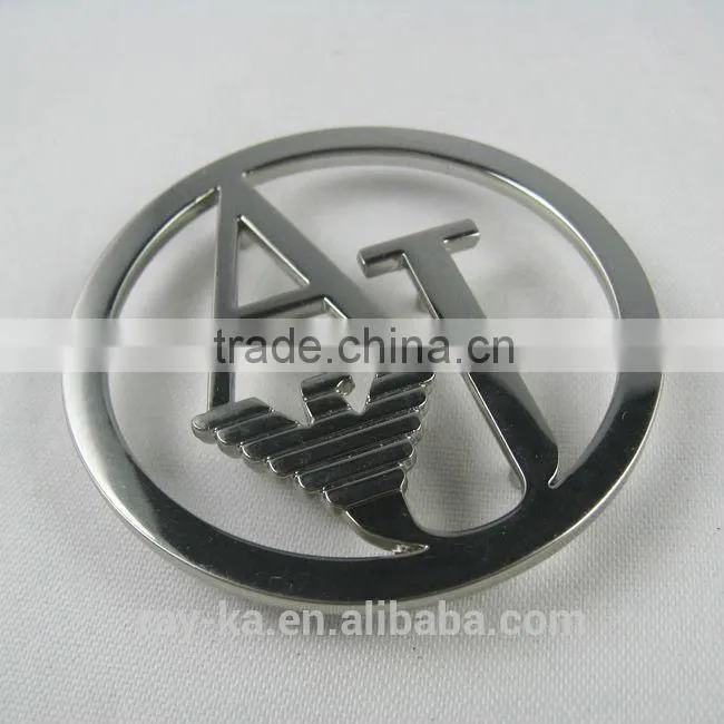 designer metal emblems handbag