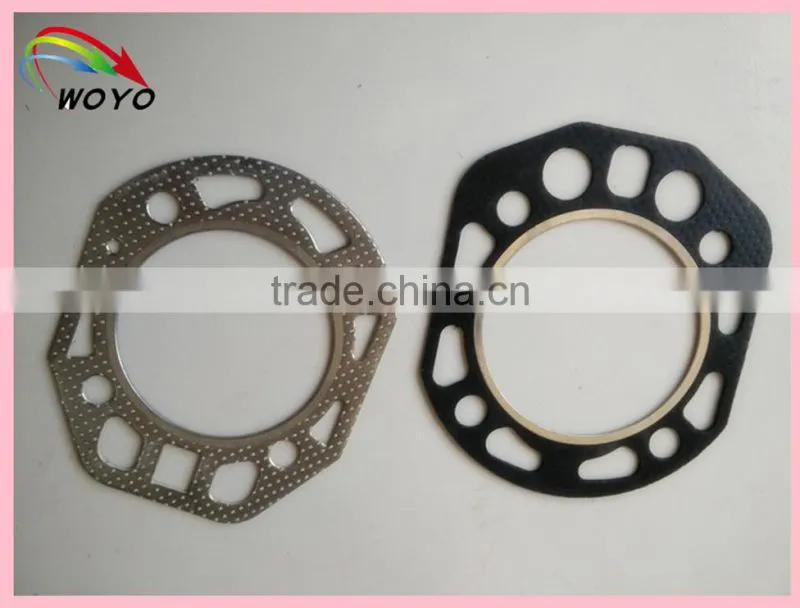 Reinforced graphite sheet with tanged metal for cylinder head gasket