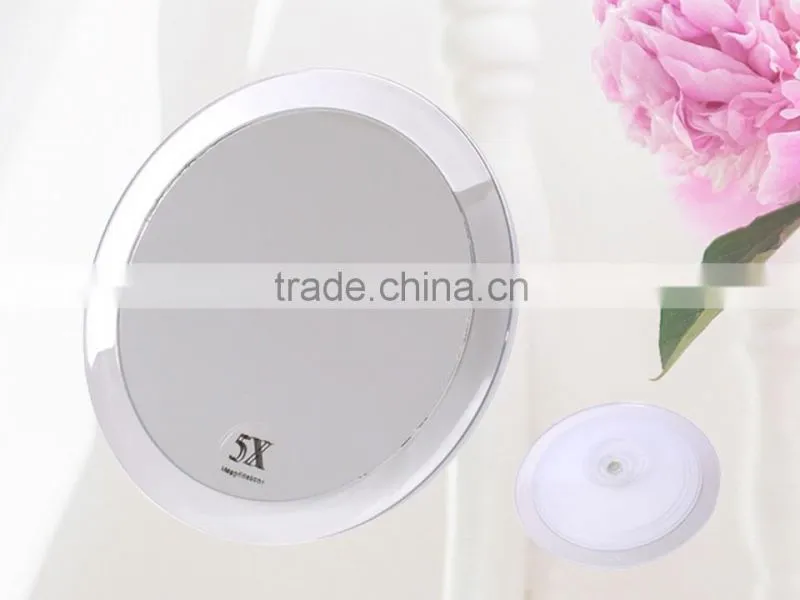 Plastic cosmetic mirror with suction cup