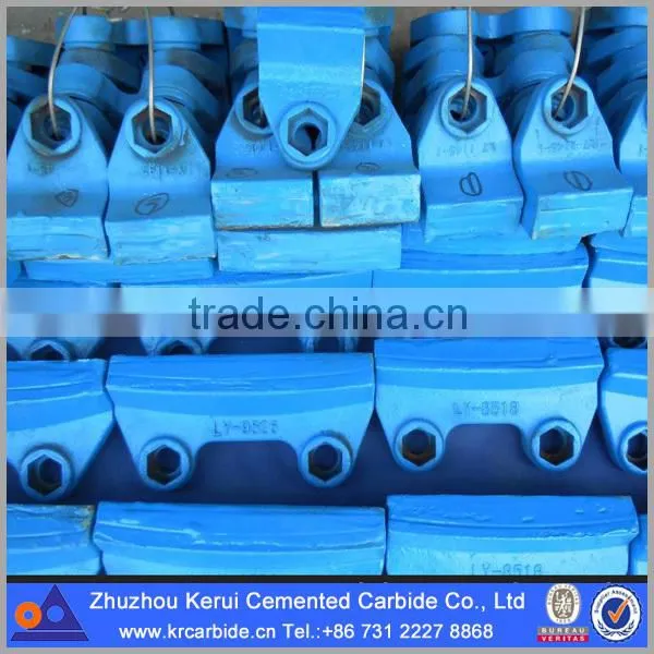 Tungsten carbide components in rotor tips for VSI crusher