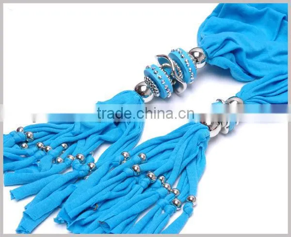 Women adorn article scarf with jewelry