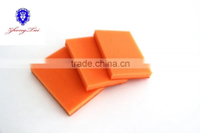orange sourcing pad with yellow sponge for kitchen supplies