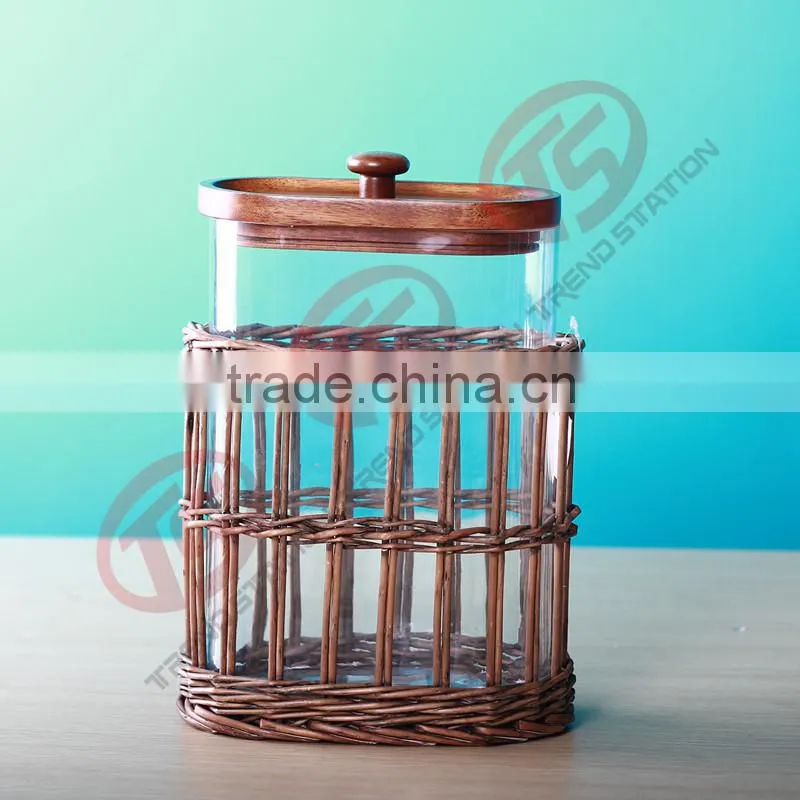 Glass herb storage jars with wooden and willow decoration