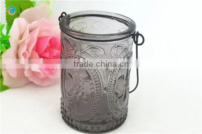 decorative wall hanging jar candle holder with black metal wiring cross pattern
