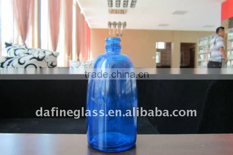 spray painted blue glass wine bottle