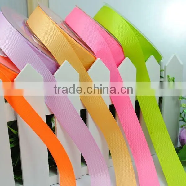 print custom ribbons wrapping around gift boxes