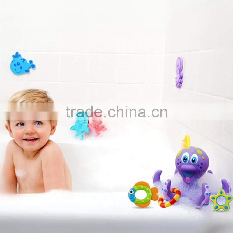 mini plastic purple Octopus and three Hula Hoops for baby bath time fun