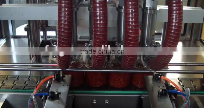 food sauce in jar bottle filler and capper