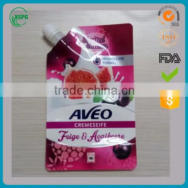 Stand up liquid packaging pouch with corner spout