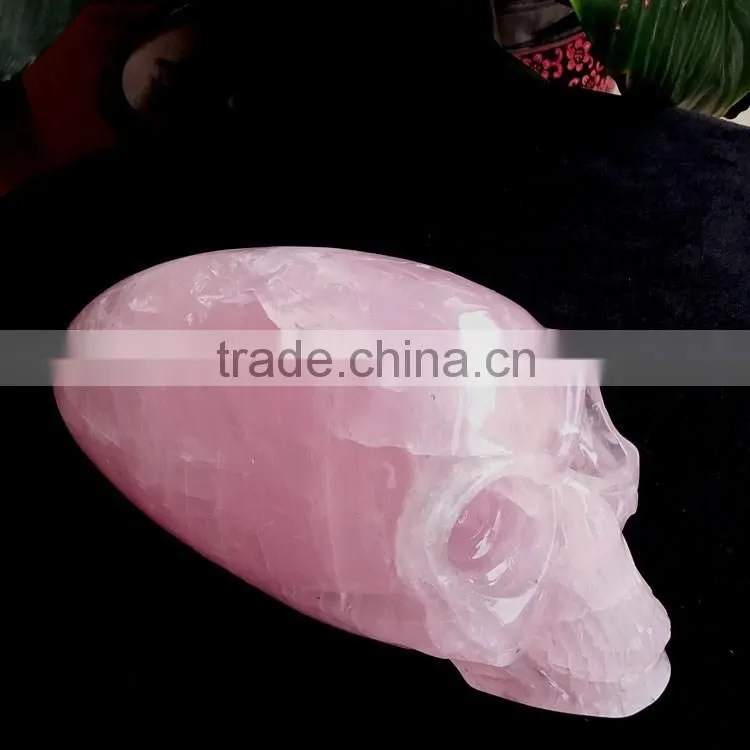 large natural rose quartz crystal alien skull for wholesale