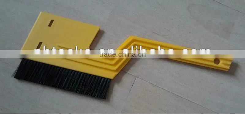 Ice scraper with brush