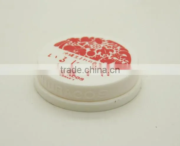 Empty lipstick container and round plastic container