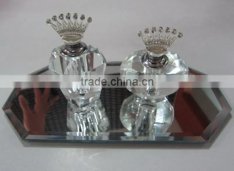 small empty clear crystal perfume bottle with jewelled metal alloy handle
