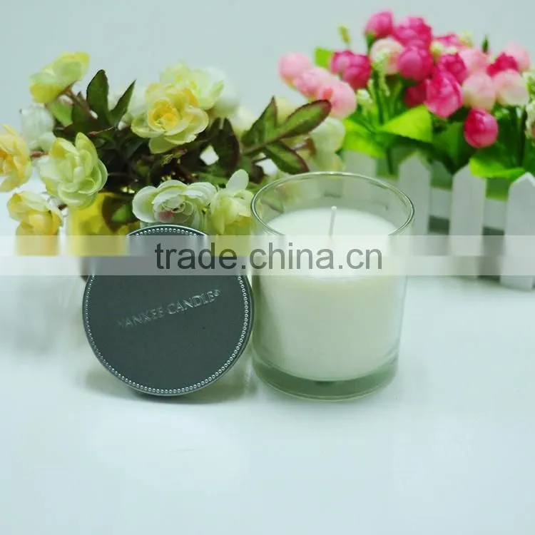 Scented candle in glass jar with metal lid
