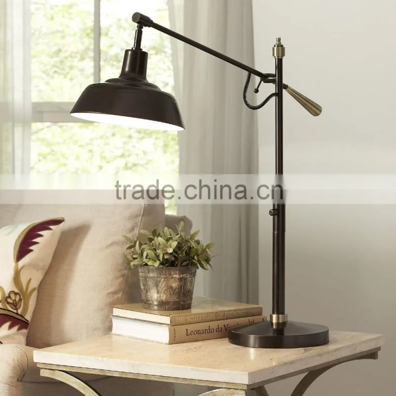 11.21-10 Crafted with a traditional silhouette adjustable arm Table Lamp bronze finish for versatility and charm