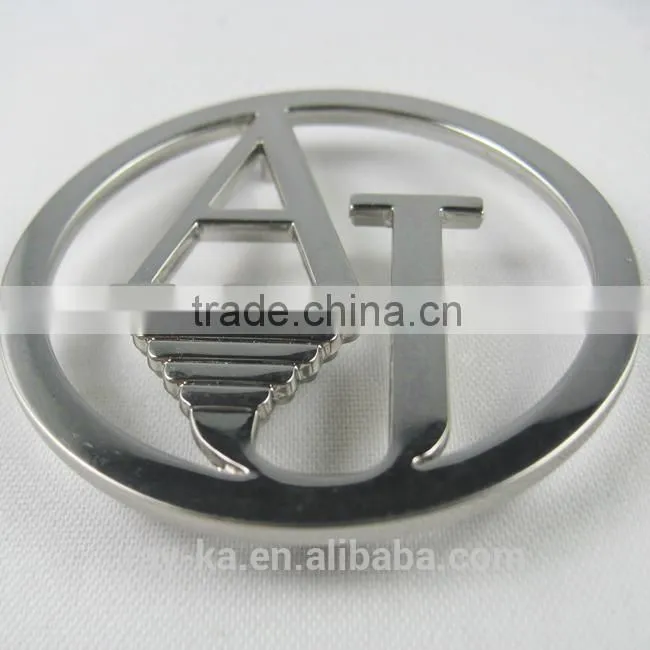 designer metal emblems handbag