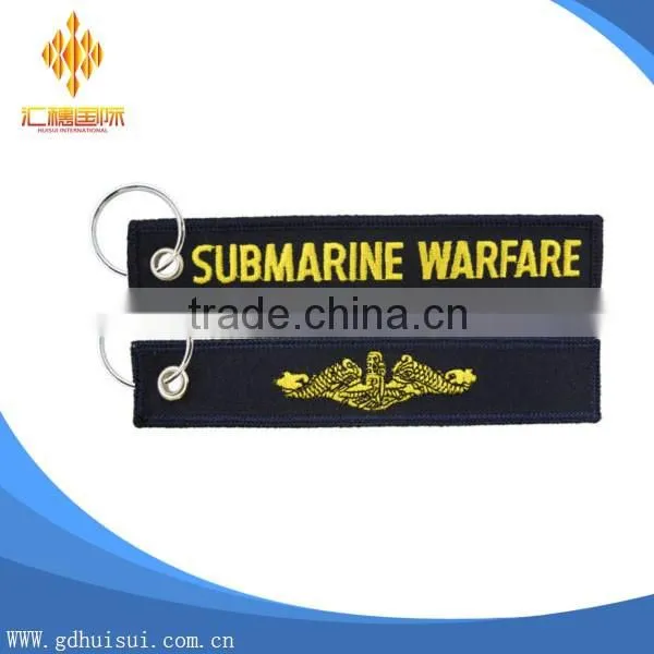 Popular design cheap customized elliptical shape embroidery personalized logo key chain