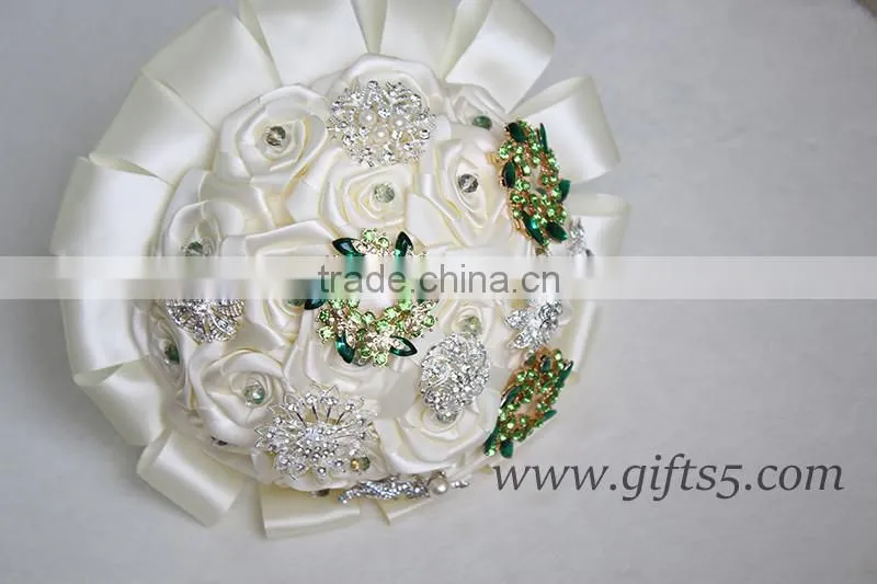 Romantic wedding bouquet full of crystal beads and green brooches
