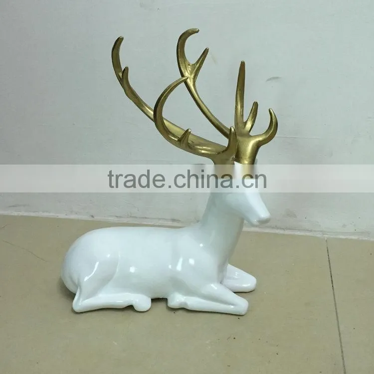Resin sitting reindeer statue
