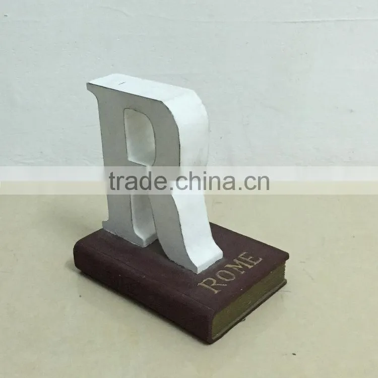 Polyresin book with letter statue