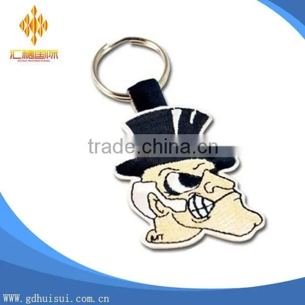 Top sale cheapest customized embroidery man's head key chain
