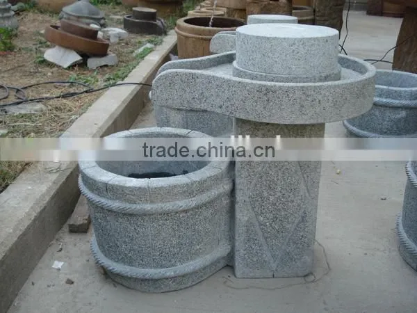 Antique millstone fountain