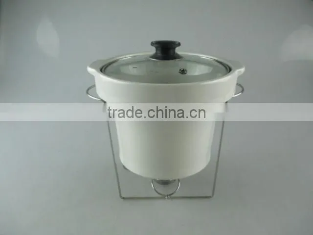 Stocked ceramic tureen with glass lid and iron stand